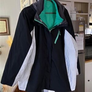 Women's Black and White Ski Jacket with Green Accents